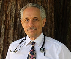 Dr. Joe Graff in front of tree